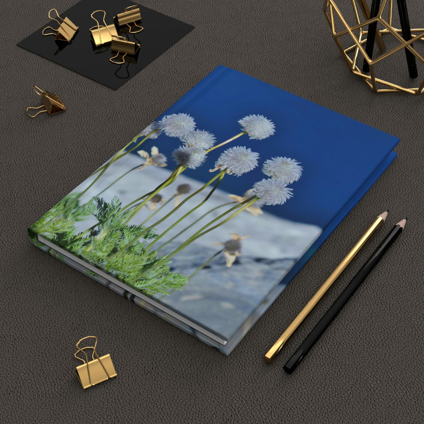 Happy dandelions swaying over a deep blue lake hardcover journal - matte finish